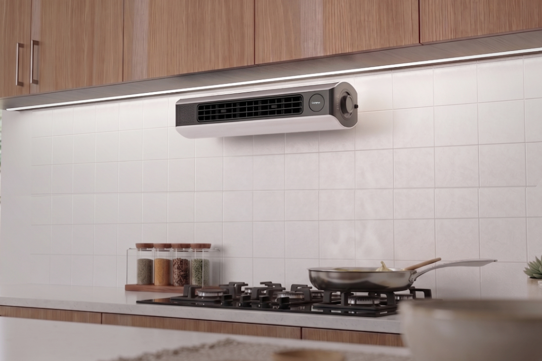 Industrial Design of a compact Air Buddy kitchen fan mounted above a cooking stove
